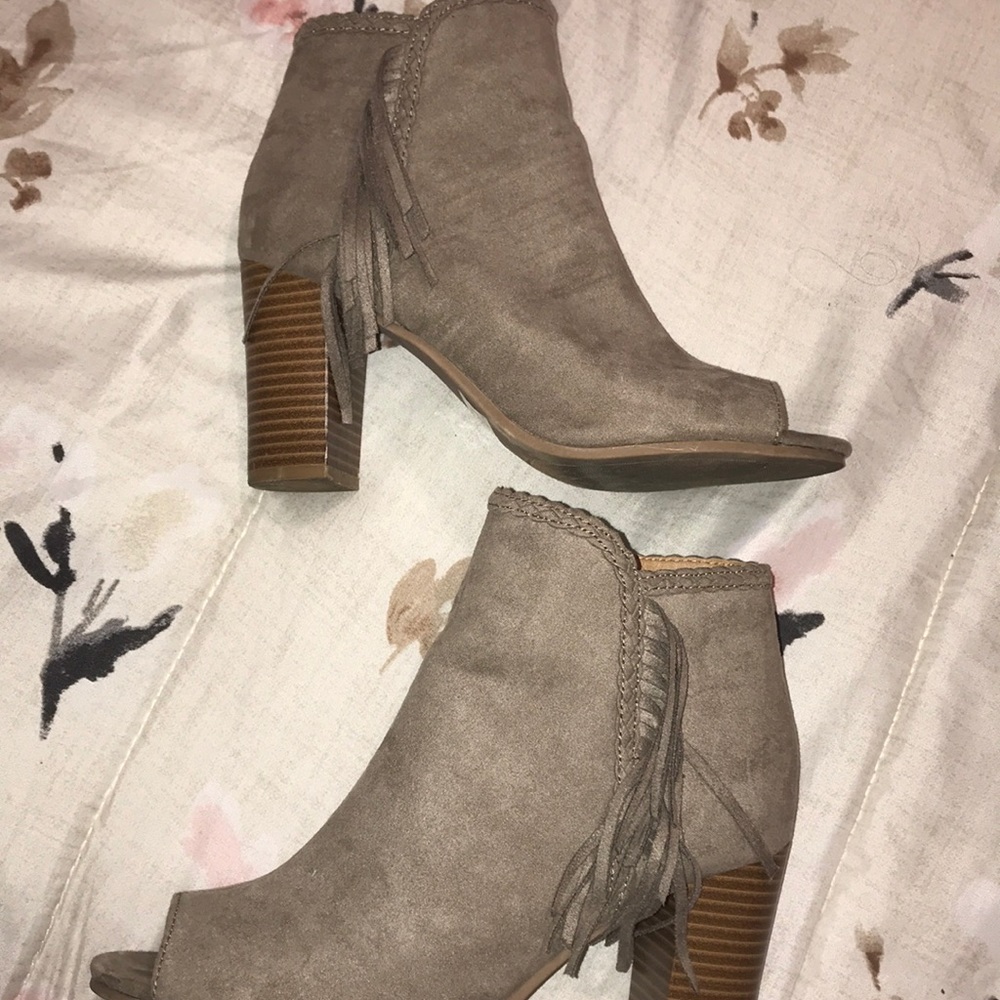 Taupe colored booties with fringe
